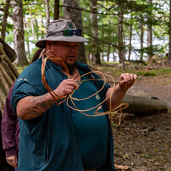 Nick Whynott holding spruce root