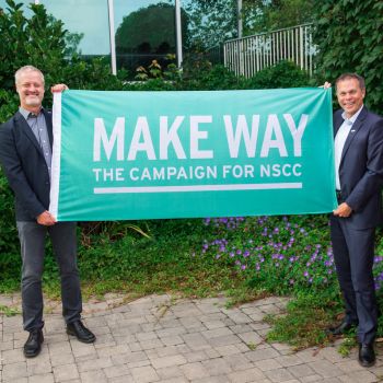 Rob Sobey and Don Bureaux holding a sign that say 'Make Way the campaign for NSCC'