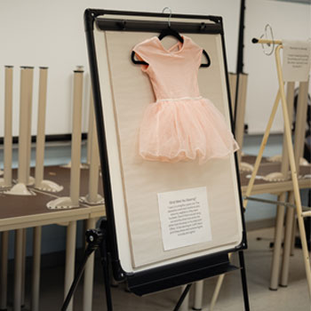 A child's outfit on display at an exhibit.