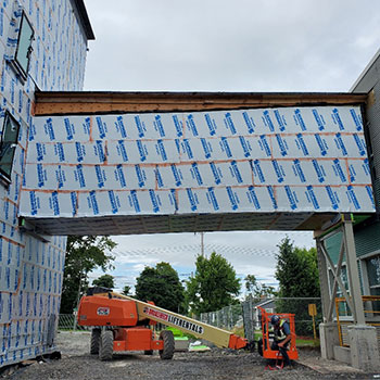 A pedway is under construction, connecting the campus to the new student housing building.