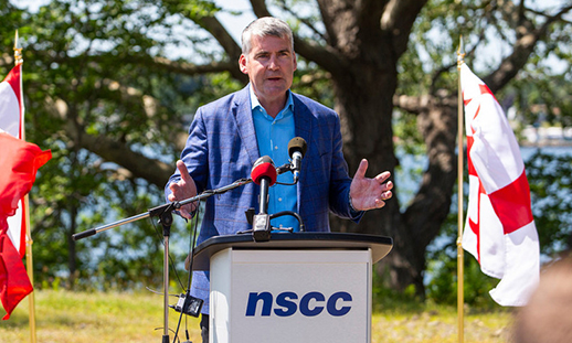 Stephen MacNeil at a podium