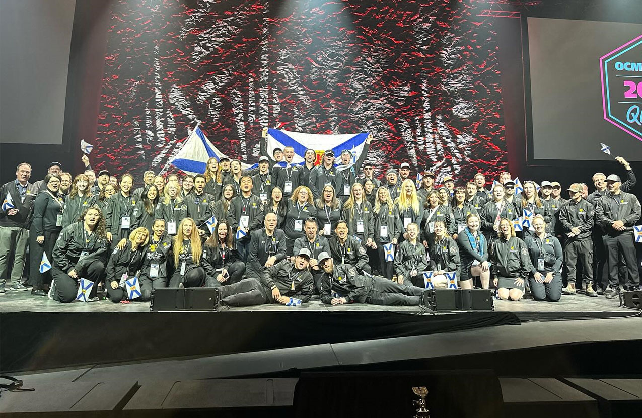 Team Nova Scotia gathers together on stand for a team photo.