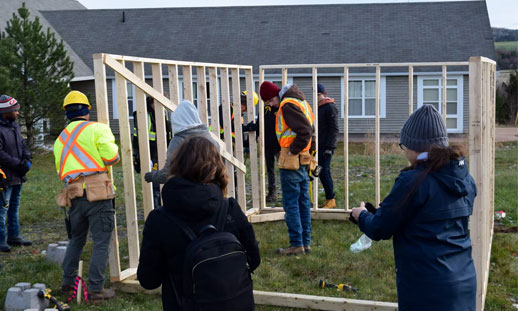 Enactus Pictou Campus members spent the day building a greenhouse at Riverview Home with the help of some carpentry students. - Adam MacInnis