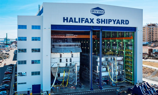 Image shows a shipyard near the ocean.