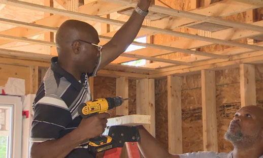 Apprentice Vincent Kennedy learns on the job from Howard Benjamin. The construction sector in Nova Scotia is feeling the squeeze particularly hard, due in part to the government mandate to provide more housing. (Brian MacKay/CBC)