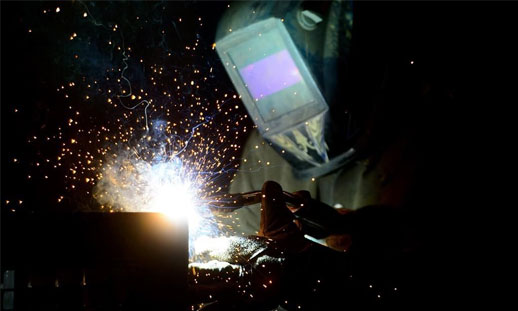 Photo of someone welding.