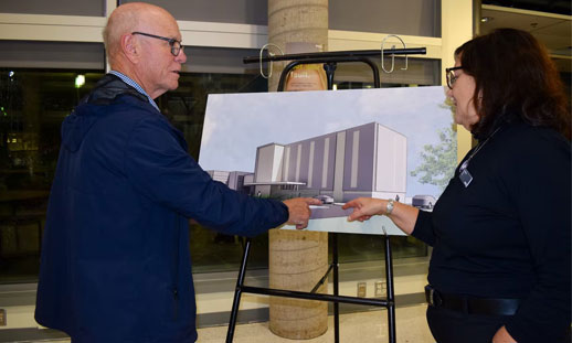 Lennie White discusses the new student housing facility with NSCC Pictou Campus principal Maxine Mann. - Photo by Ray Burns