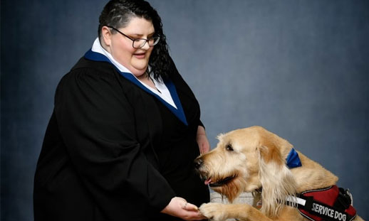 Levon Beck is starting her second year at the Nova Scotia Community College this fall. She is pictured with her service dog, Thomas. (Submitted by Levon Beck/Applehead Studio)