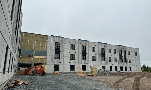 A new building under construction is shown.