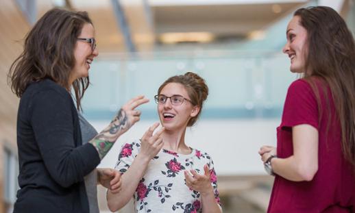 Three ASL Studies students chatting at Ivany Campus.