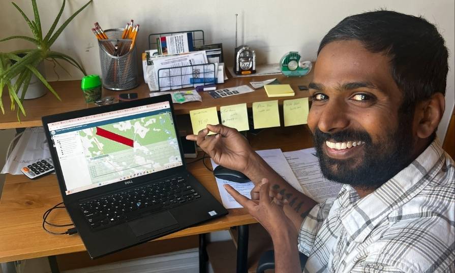 An NSCC student using a GIS software on their laptop.