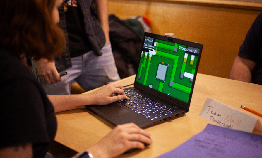 Someone playing a game on a computer.