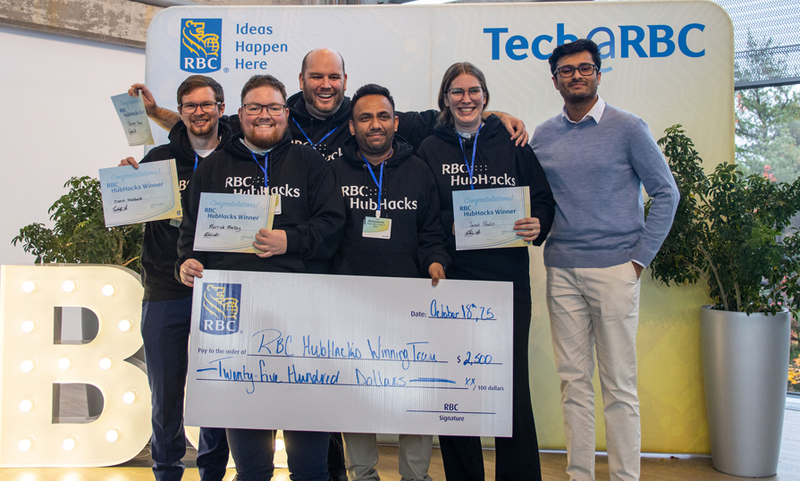 A group of NSCC students gather for a photo holding a large cheque for winning first place.