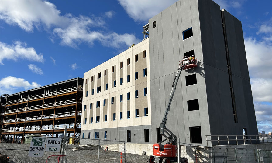 Photo shows a building under construction.