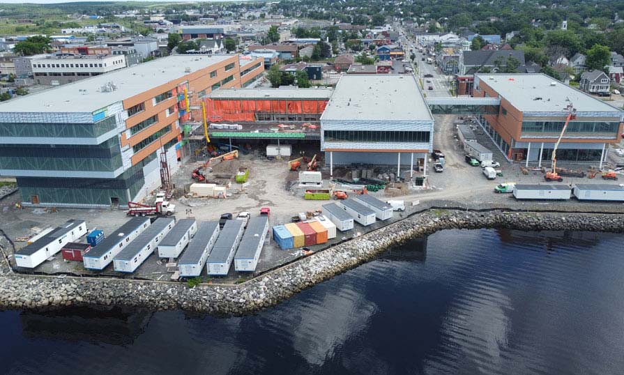 A drone shows an overhead view of a new campus being built.