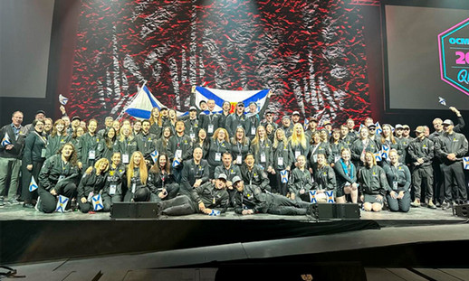 Team Nova Scotia gathers together on stand for a team photo.