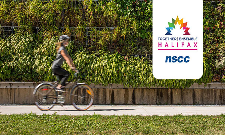 A woman is riding a bike passed a wall covered in live plants. There is a NSCC logo in the top right corner with the Together | Ensemble conference logo.