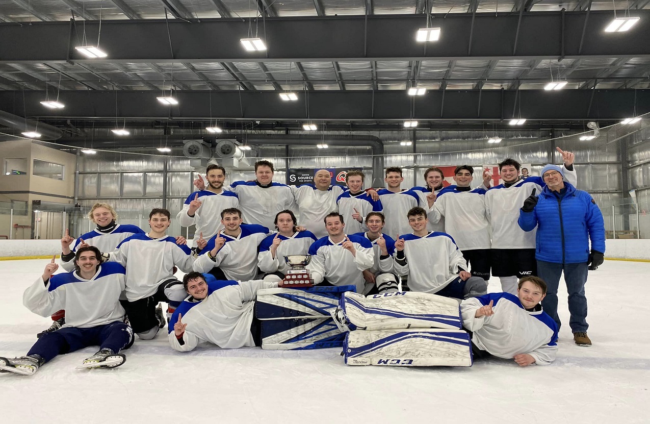 Students celebrating after winning a hockey tournament.