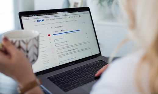 An eCampus student accesses NSCC learning portals remotely using a laptop.