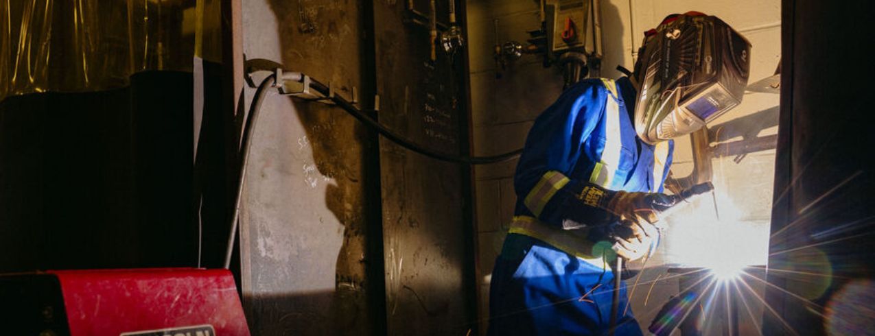 An NSCC graduate works onsite at Irving Shipbuilding.