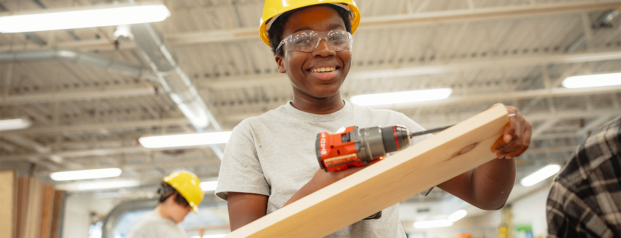 A youth participates in a skilled trades activity at an NSCC campus. 