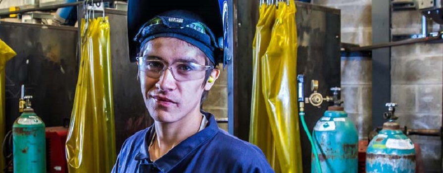 Marine rigger Jyred Nauss works on a piece of equipment.