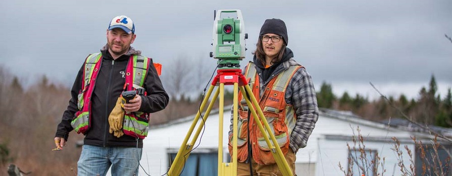 COGS grad Jill Ejdrygiewicz examines a piece of equipment.