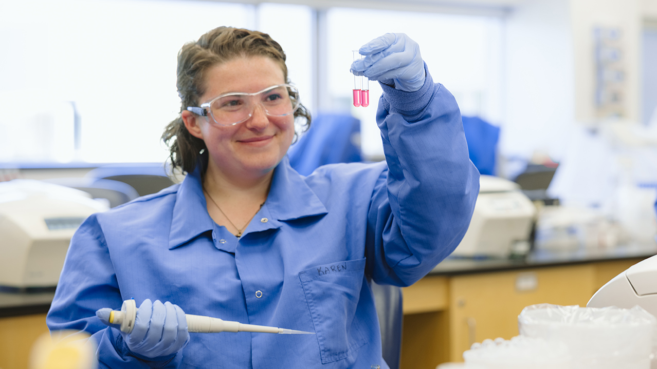 An NSCC Medical Laboratory Technology student tests a sample in the lab at Ivany Campus. They are wearing protective eyewear.