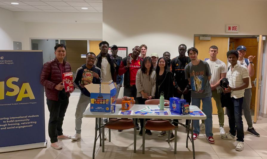 A group of students stand together during an event at an NSCC campus.