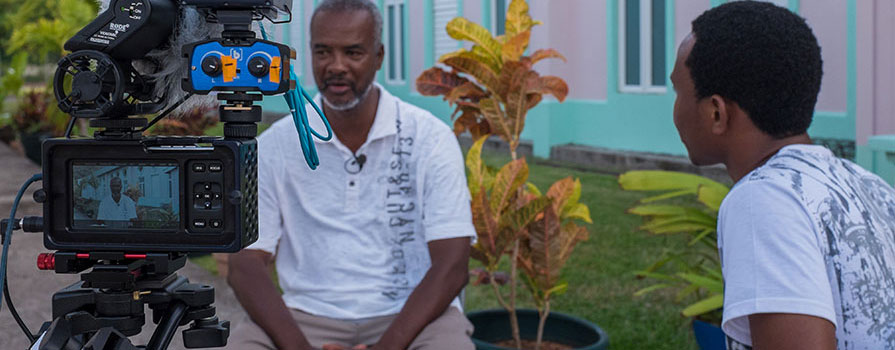 A person being filmed during an interview