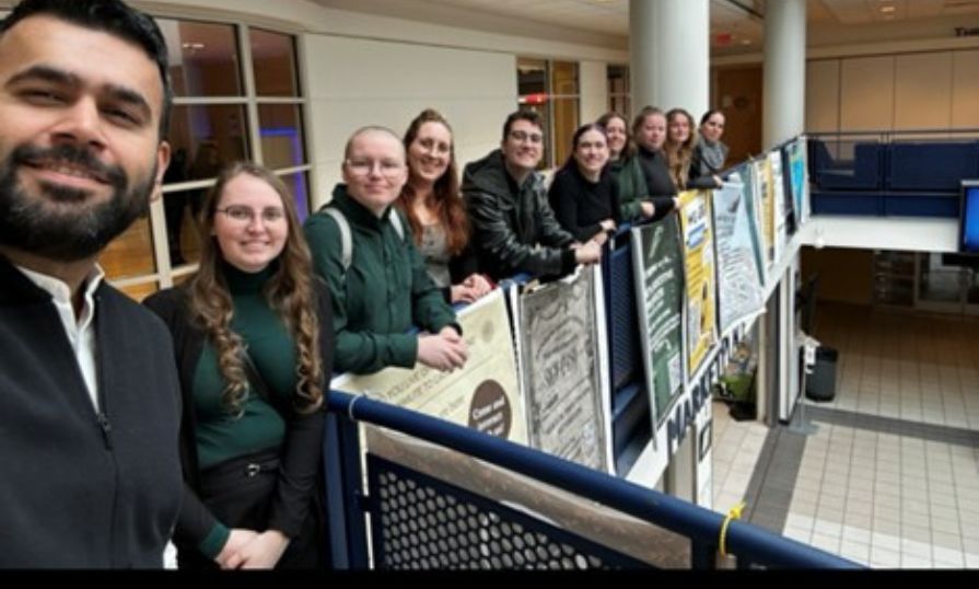 Group of students smiling on a corridor during a visit to Gallaudet University.