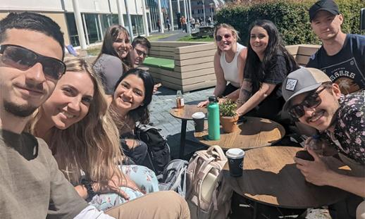 Dawson sitting at a table with a group of people