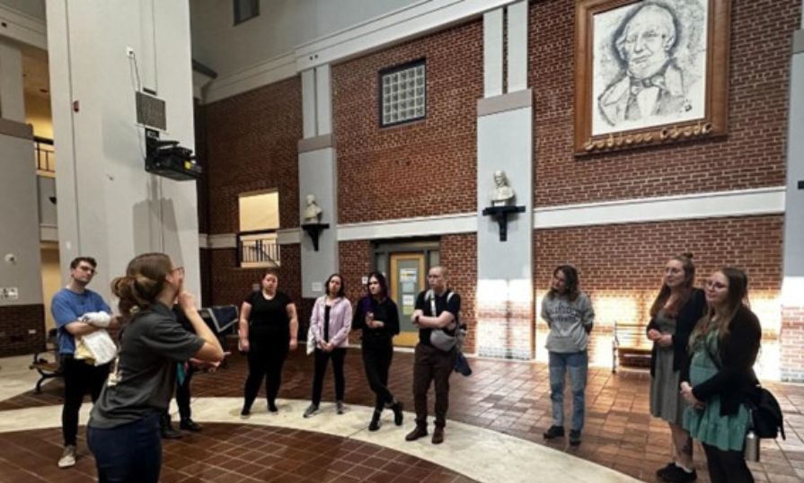 A group of students on a guided tour or participating in an educational event for ASL at Gallaudet University