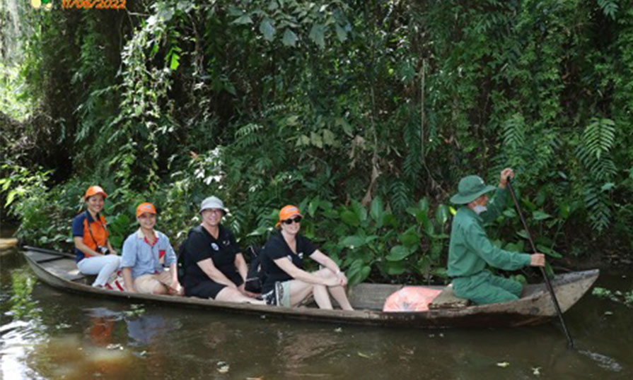 Sheri with a group of people on a local boat