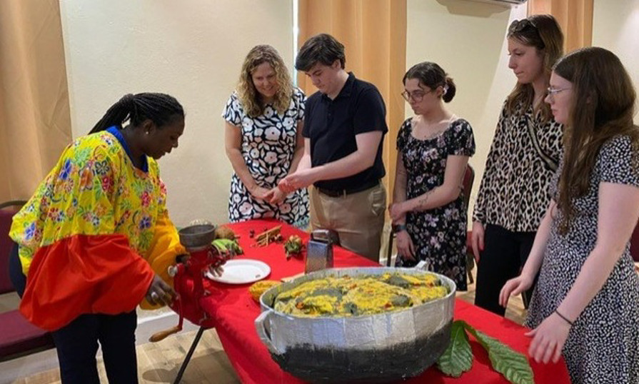 Students learn traditional cooking during a cultural exchange in Grenada