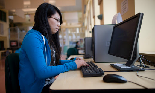 Woman sitting in front of a computer