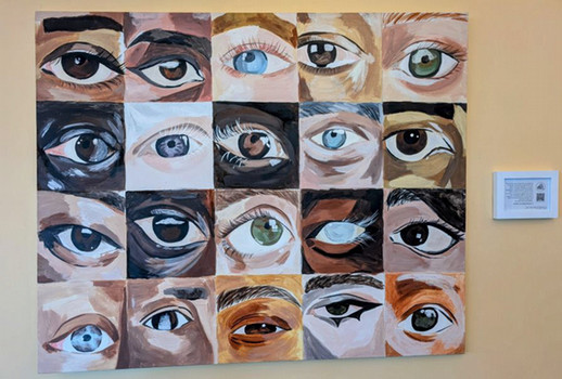 art piece with several eyes of different colours and shapes