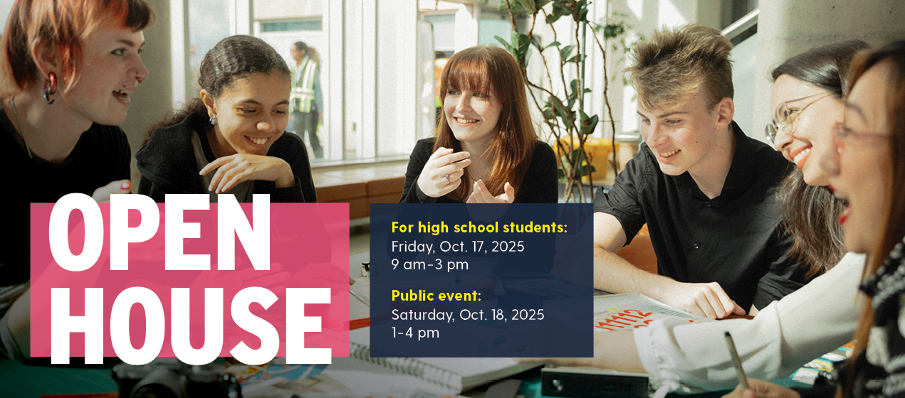 A group of students sit at a table in a common area of an NSCC campus.