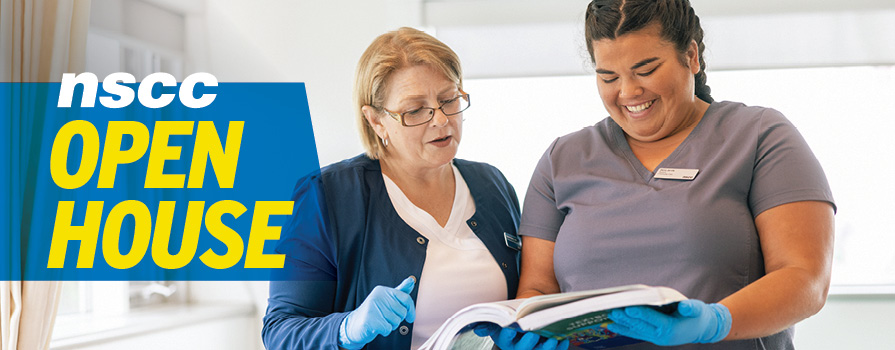 Two women examine a folder